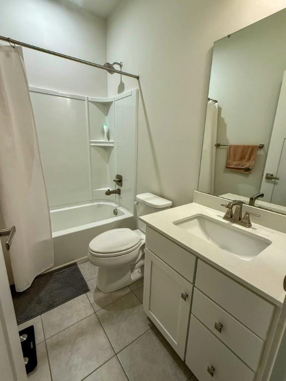 bathroom featuring vanity, toilet, tile patterned flooring, and shower / tub combo with curtain