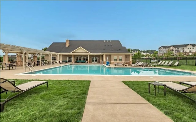 community pool with a lawn, fence, a patio area, and a pergola
