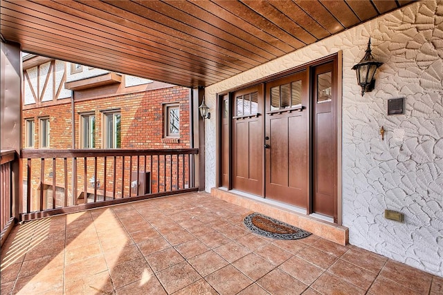 property entrance featuring brick siding