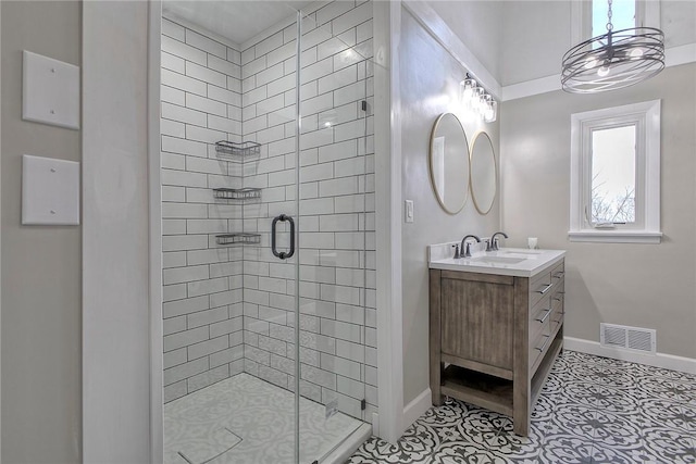 full bath featuring visible vents, baseboards, a shower stall, vanity, and tile patterned flooring