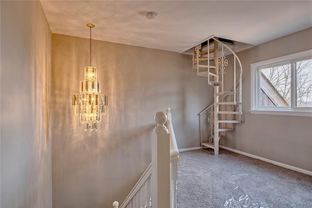 stairs with carpet floors, baseboards, and a notable chandelier