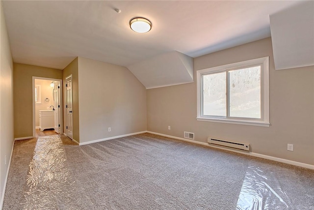 bonus room featuring visible vents, baseboards, baseboard heating, carpet flooring, and lofted ceiling