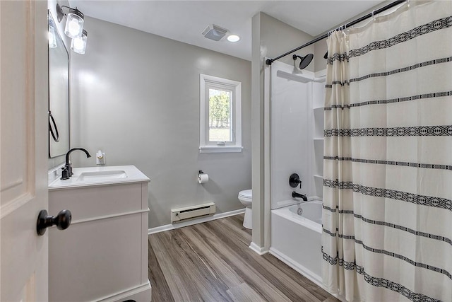 full bath featuring vanity, baseboards, toilet, a baseboard radiator, and wood finished floors