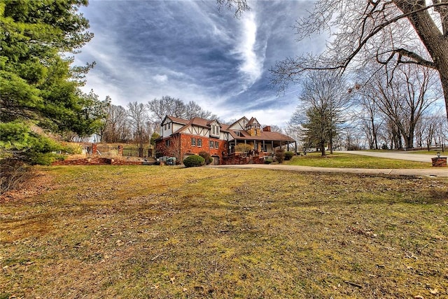view of yard featuring covered porch