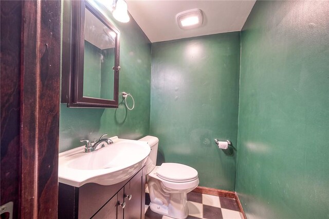 1223 Chelton Ave, Brookline, PA 15226 - half bath featuring tile patterned floors, baseboards, vanity, and toilet