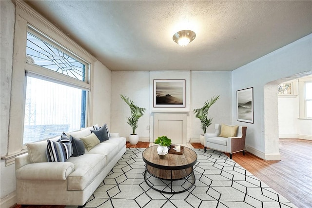 1223 Chelton Ave, Brookline, PA 15226 - living area with light wood-style flooring, a textured ceiling, and baseboards