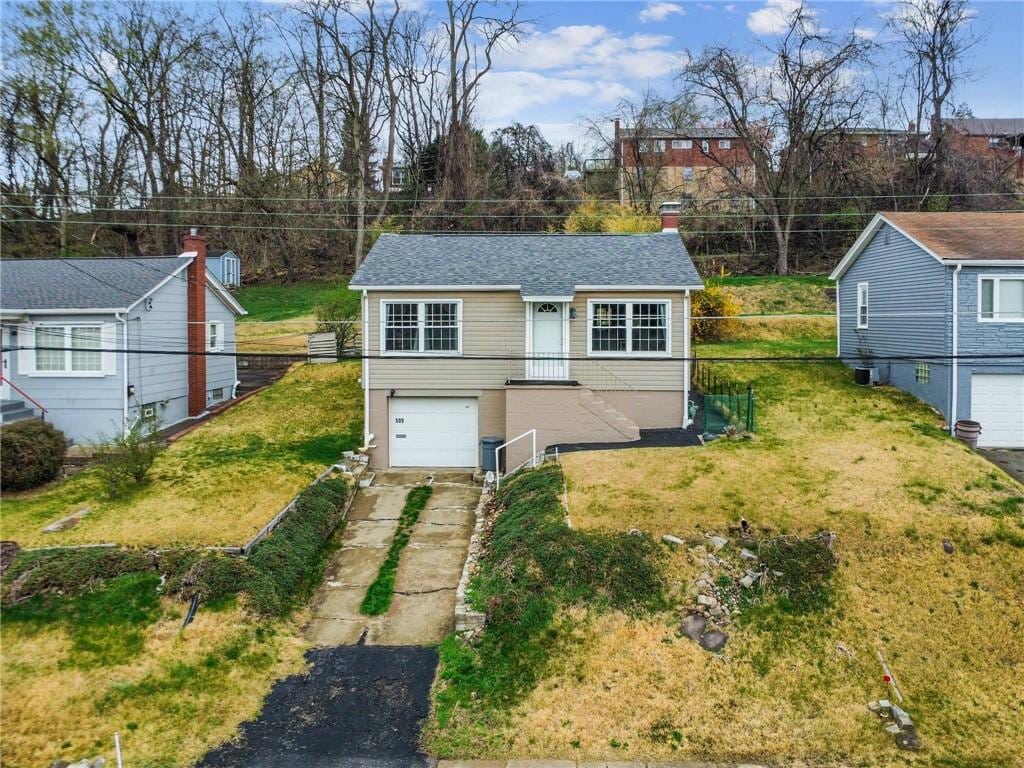 509 Beech St, West Mifflin, PA 15122 - view of outbuilding featuring fence, a garage, and driveway