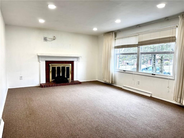unfurnished living room featuring a baseboard radiator, a fireplace, carpet, and recessed lighting