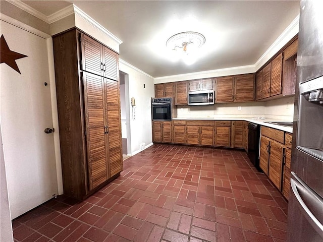 kitchen featuring crown molding, light countertops, black appliances, and brick floor