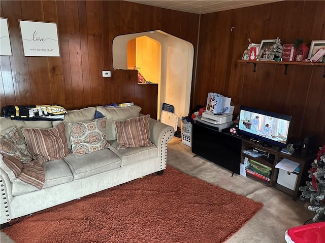 555 Farnsworth Ave, Clairton, PA 15025 - living room featuring arched walkways, wood walls, and carpet