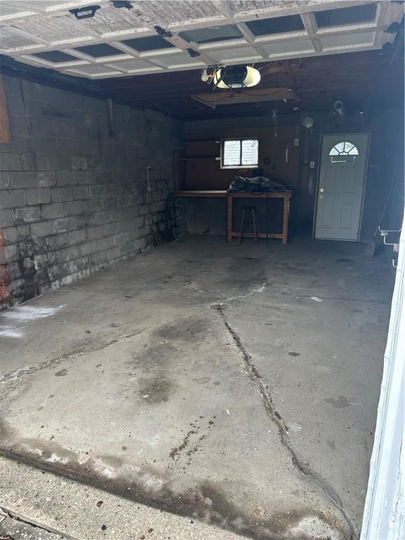 555 Farnsworth Ave, Clairton, PA 15025 - garage with a garage door opener and concrete block wall