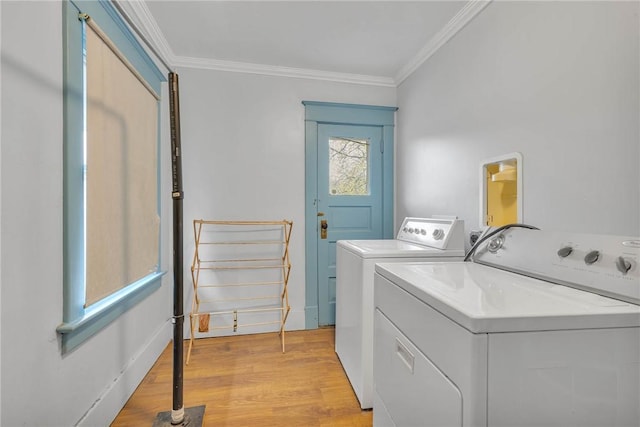 338 4th St, Beaver, PA 15009 - washroom featuring crown molding, light wood finished floors, washing machine and dryer, and laundry area