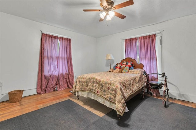 338 4th St, Beaver, PA 15009 - bedroom with a ceiling fan, wood finished floors, and multiple windows