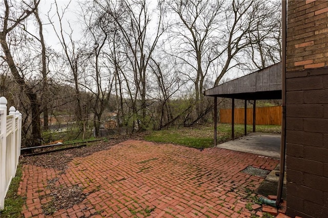 view of patio featuring fence
