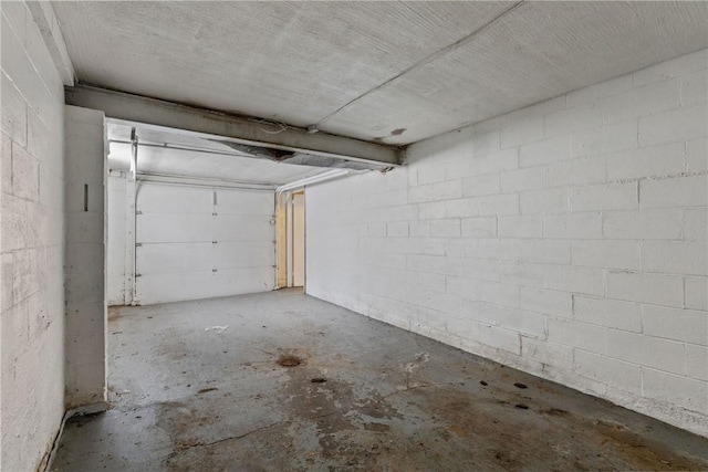 garage featuring concrete block wall