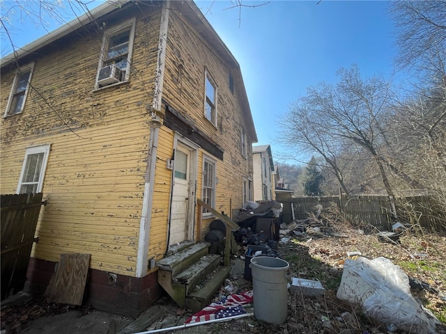 140 Baker St, Aliquippa, PA 15001 - view of home's exterior featuring entry steps, fence, cooling unit, and crawl space