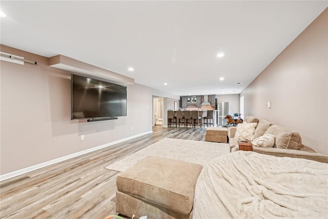 bedroom featuring baseboards, recessed lighting, and wood finished floors