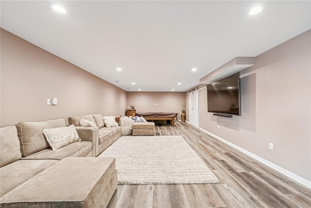 unfurnished living room featuring light wood-type flooring, baseboards, billiards, and recessed lighting