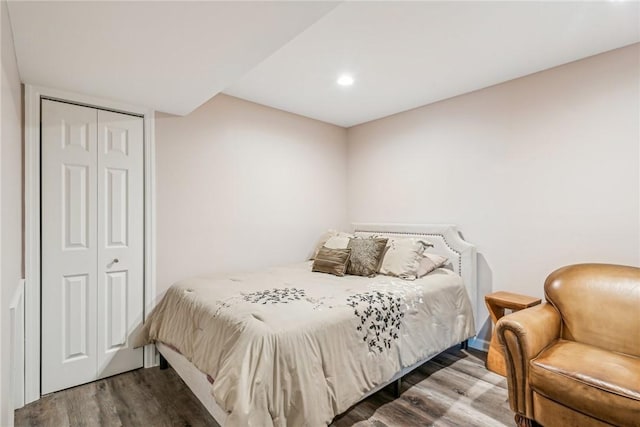 bedroom featuring a closet and wood finished floors