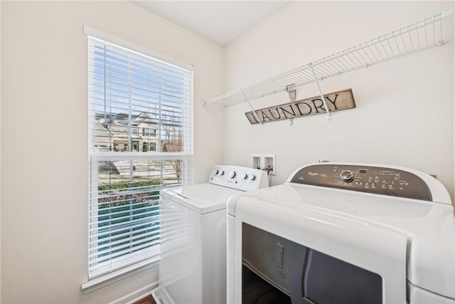laundry room featuring washer and clothes dryer and laundry area