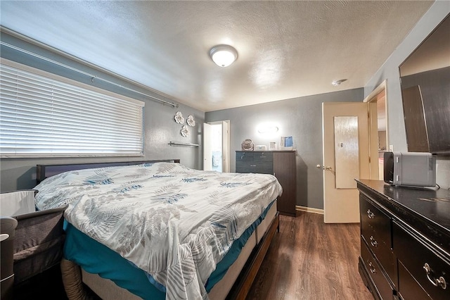 428 Brunner, Monroeville, PA 15146 - bedroom with a textured ceiling, baseboards, and dark wood-style floors