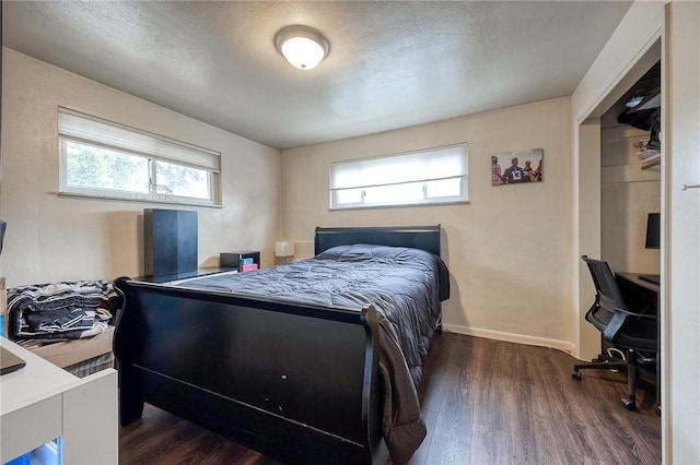 428 Brunner, Monroeville, PA 15146 - bedroom with a textured ceiling, wood finished floors, baseboards, and multiple windows