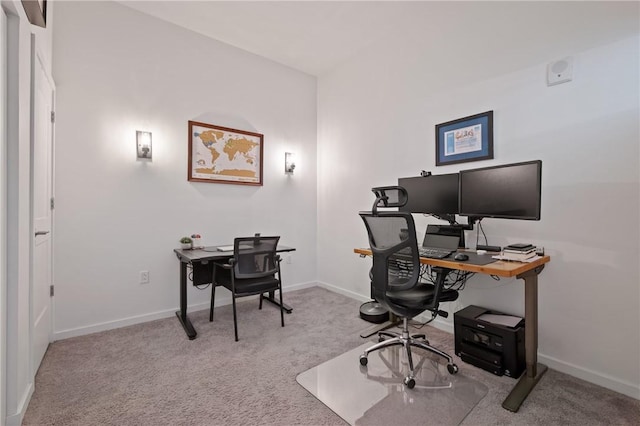 office space featuring baseboards and carpet