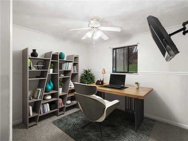 home office with ceiling fan, baseboards, ornamental molding, and carpet floors