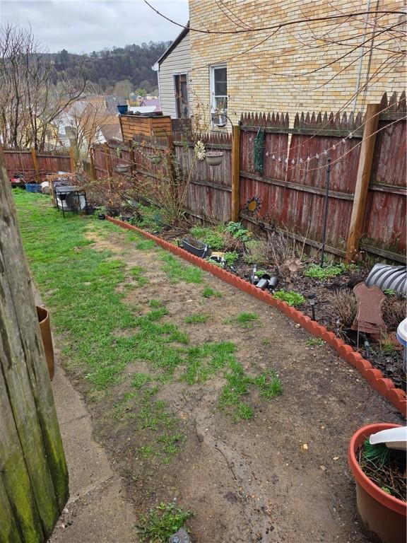 view of yard with a fenced backyard
