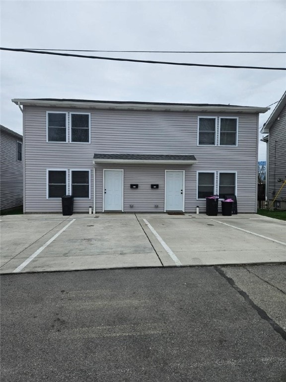 view of front of house with uncovered parking