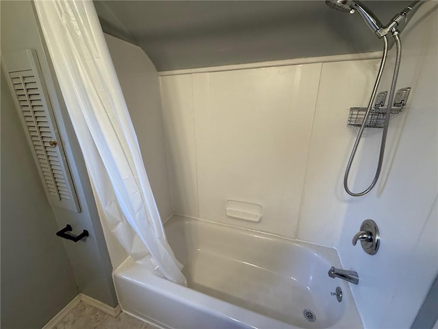 full bathroom with shower / tub combo