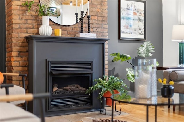 room details with wood finished floors and a fireplace