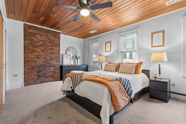 carpeted bedroom with brick wall, visible vents, wooden ceiling, and ceiling fan