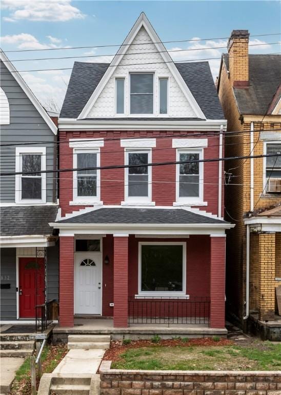 830 Adelaide St, Schenley Heights, PA 15219 - townhome / multi-family property with cooling unit, a shingled roof, and covered porch