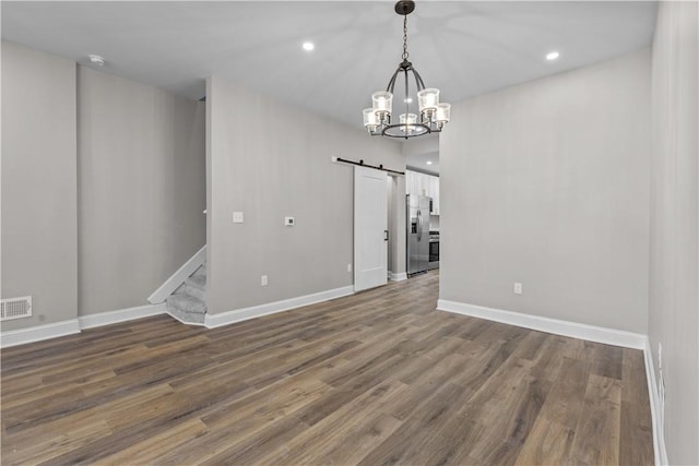 830 Adelaide St, Schenley Heights, PA 15219 - interior space featuring baseboards, a notable chandelier, a barn door, stairway, and wood finished floors