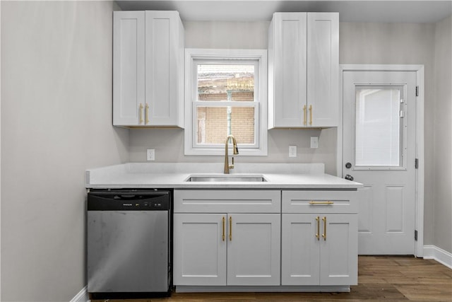 830 Adelaide St, Schenley Heights, PA 15219 - kitchen featuring light countertops, stainless steel dishwasher, a sink, and baseboards