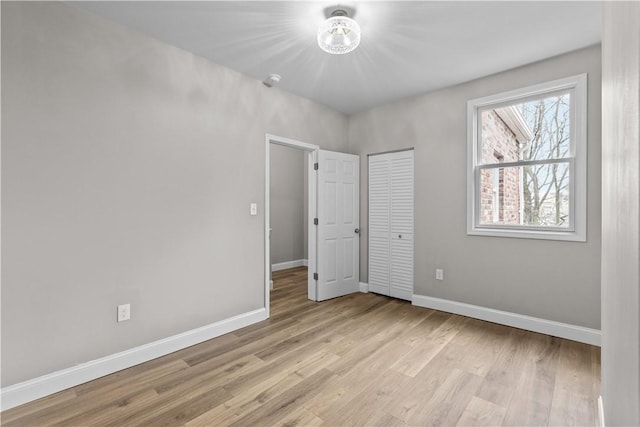 830 Adelaide St, Schenley Heights, PA 15219 - unfurnished bedroom with a closet, baseboards, and light wood-type flooring