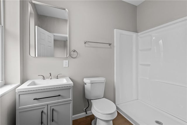 830 Adelaide St, Schenley Heights, PA 15219 - full bathroom with vanity, toilet, wood finished floors, a stall shower, and baseboards