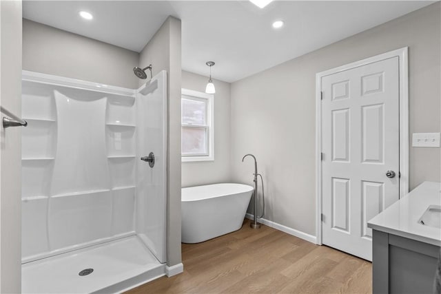 830 Adelaide St, Schenley Heights, PA 15219 - full bath with vanity, a freestanding bath, baseboards, a shower, and wood finished floors