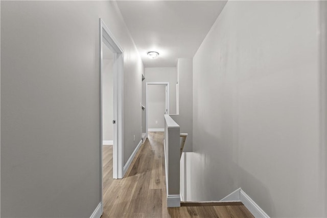 830 Adelaide St, Schenley Heights, PA 15219 - corridor featuring light wood-style floors, baseboards, and an upstairs landing