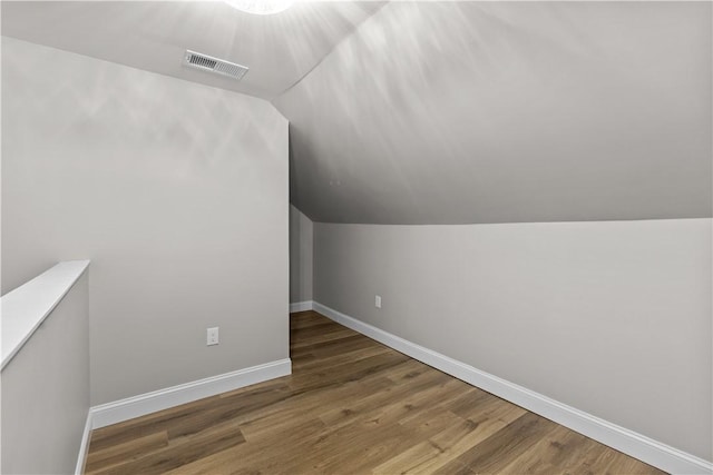 830 Adelaide St, Schenley Heights, PA 15219 - additional living space with visible vents, baseboards, wood finished floors, and lofted ceiling