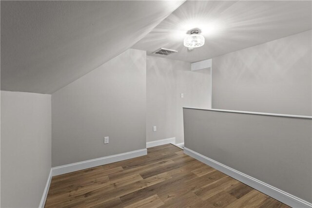 830 Adelaide St, Schenley Heights, PA 15219 - bonus room with visible vents, baseboards, vaulted ceiling, and wood finished floors