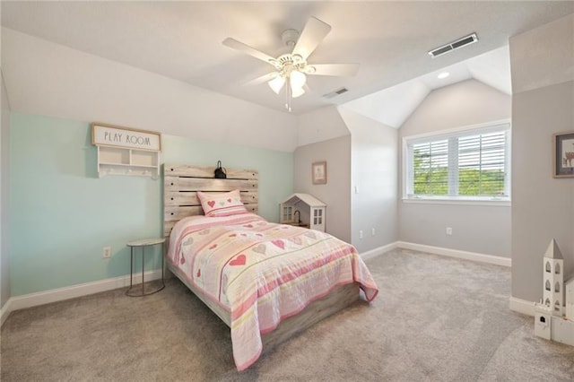 carpeted bedroom with visible vents, baseboards, vaulted ceiling, and a ceiling fan