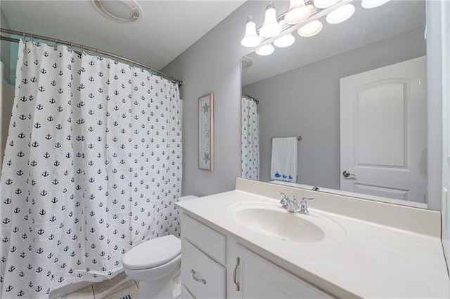 full bathroom featuring toilet, tile patterned floors, vanity, and a shower with shower curtain