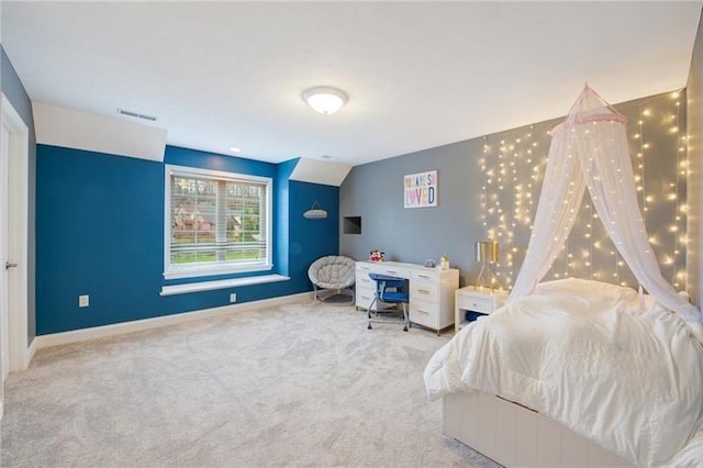 carpeted bedroom featuring visible vents and baseboards