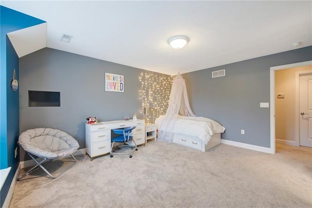 carpeted bedroom featuring visible vents and baseboards