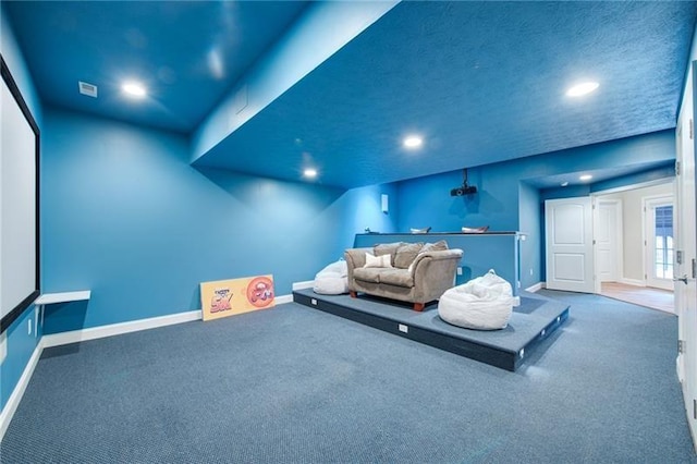 home theater room featuring visible vents, baseboards, recessed lighting, and carpet