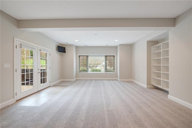 carpeted empty room featuring french doors, baseboards, and recessed lighting