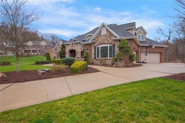 view of front of house featuring brick siding, a front lawn, stone siding, and driveway