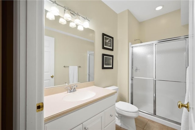 full bathroom with toilet, tile patterned floors, a shower stall, and vanity